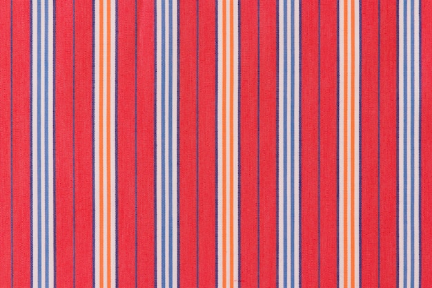 Blue and orange stripes on red background