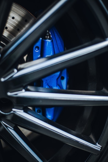 Blue pads on the wheel of a car.