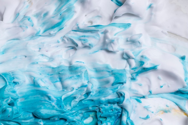 Blue paint with smooth textured white foam background