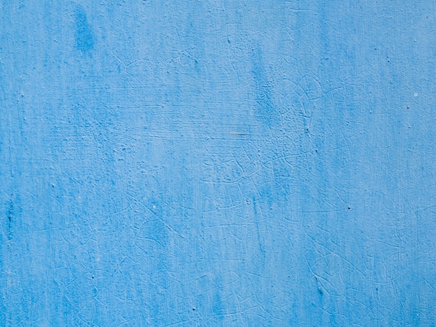 Blue painted textured wall background