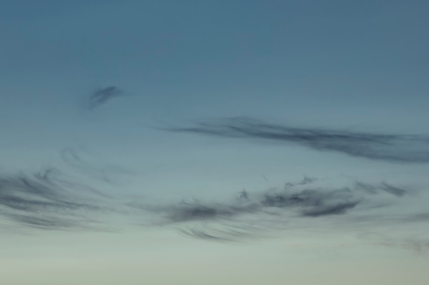 Blue pale sky with clouds