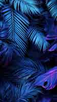 Free photo blue palm leaves wallpaper background concept for phone screen of palm leaves neon light vertical