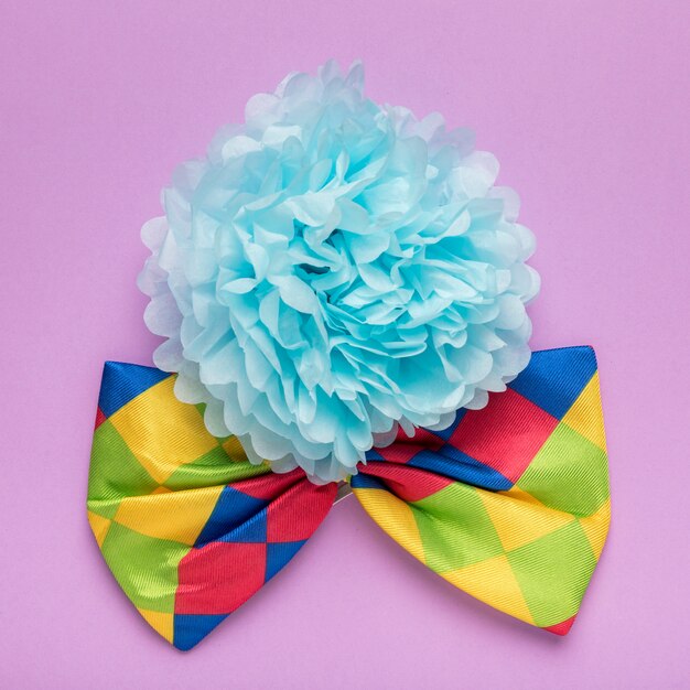 Blue paper flower and colorful bow tie