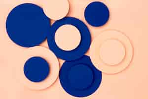 Free photo blue and peach paper circles background