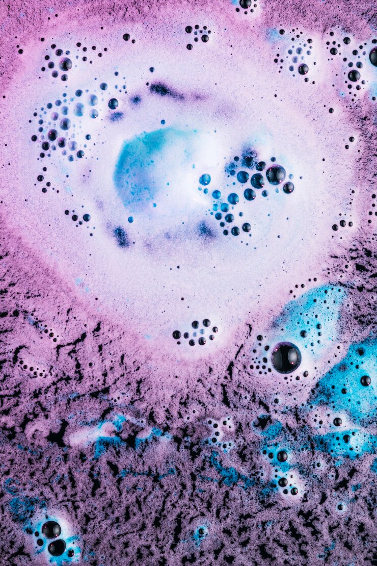 Free Photo blue and pink foam on black water