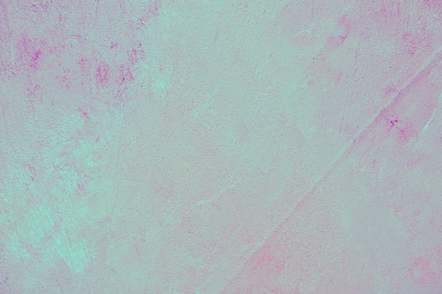 Синяя и розовая краска на бетонной стене