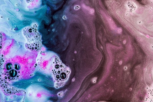 Blue and pink suds mixing 