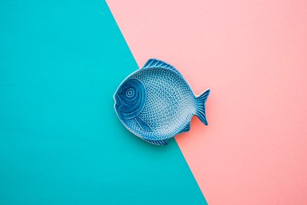 Blue and pink surface with decorative fish