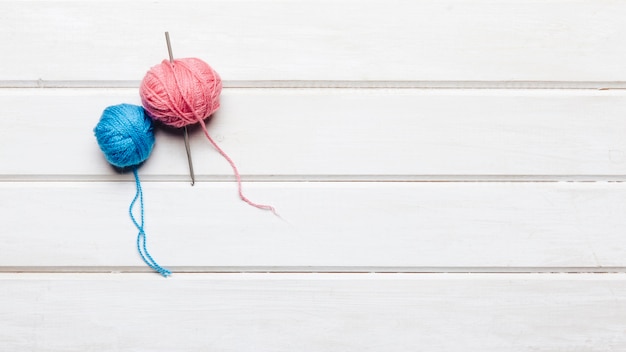 Blue and pink wool balls with space