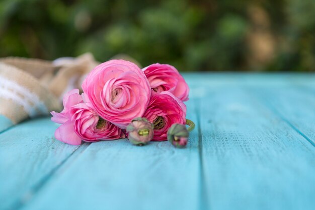 Blue planks with pink flowers