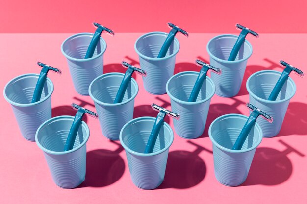 Blue plastic cups and razor blades