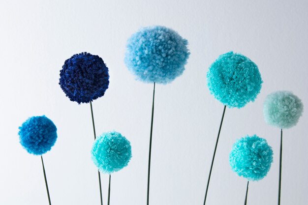 Blue pom poms arrangement top view