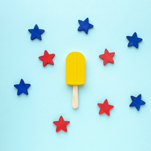 Blue and red stars beside ice cream on stick