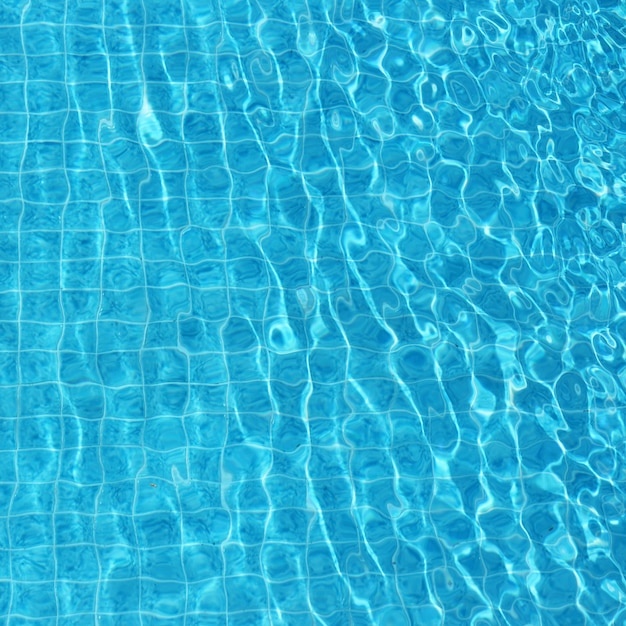 Blue rippled water background in swimming pool