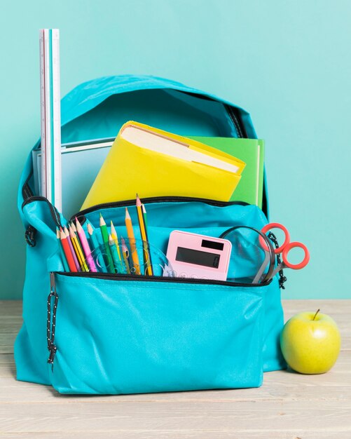 Blue school bag with essential supplies