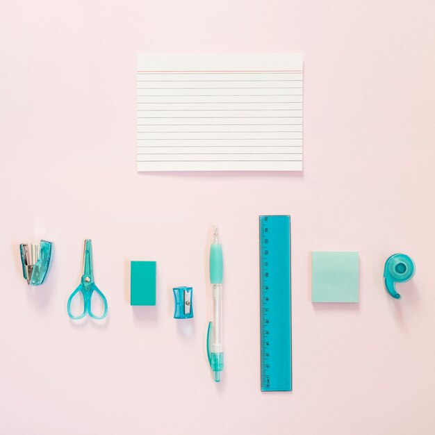 Blue school supplies with notes and copy space