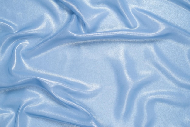 Голубая блестящая жемчужная ткань в качестве фона. вид сверху.