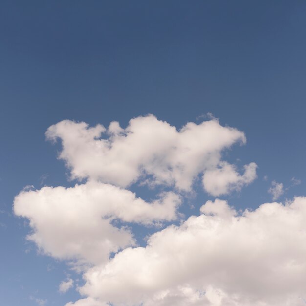 Blue sky with fluffy clouds