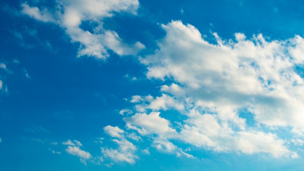 Blue sky with puffy white clouds