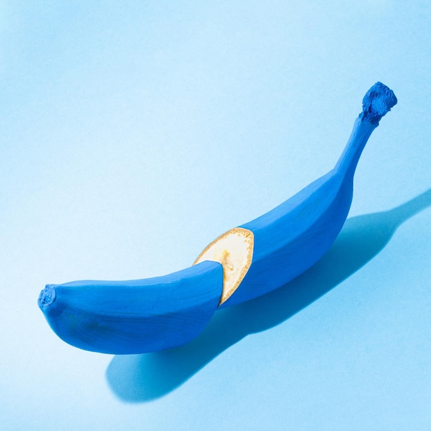 Blue sliced banana on a pastel background
