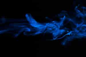 Free photo blue smoke overlay texture movement on black background