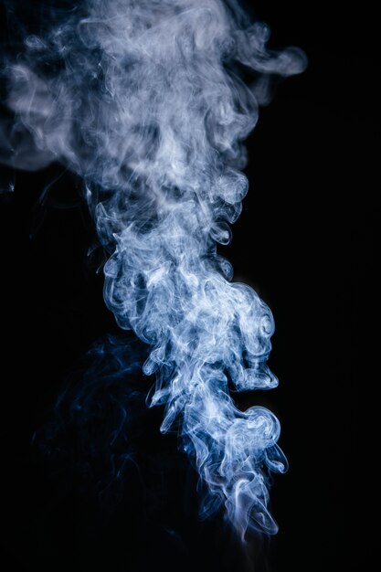 Blue smoke waves on black background