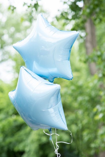 Blue starry balloons with blurry background