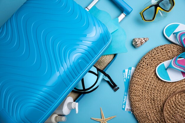 Blue suitcase with travel paraphernalia