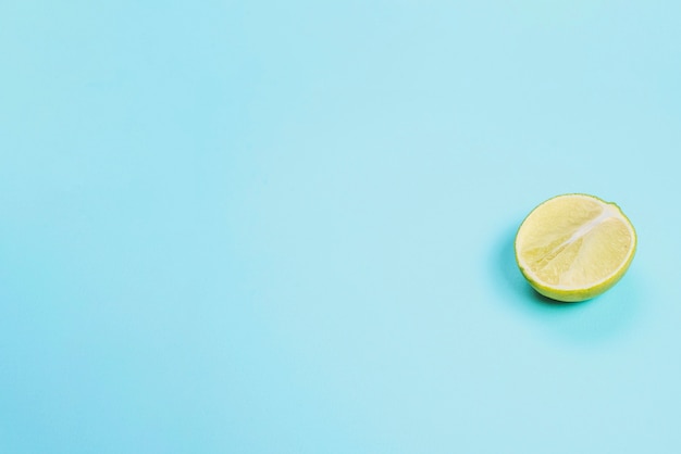 Free photo blue surface with half lime