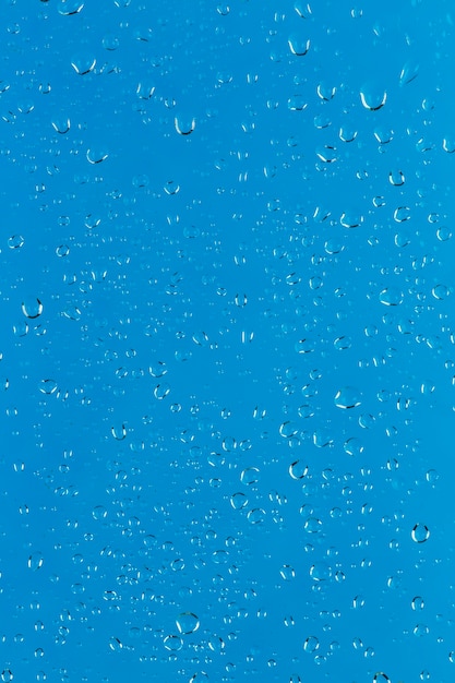 Blue surface with water droplets