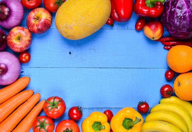 Blue table full of vegetables