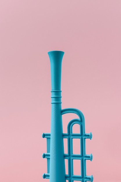 Free photo blue trumpet with copy space