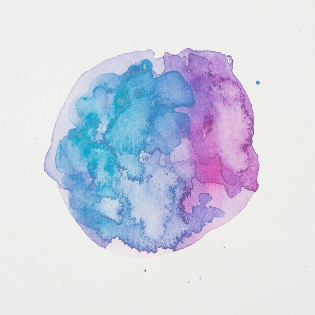 Blue and violet paints in form of circle on white paper