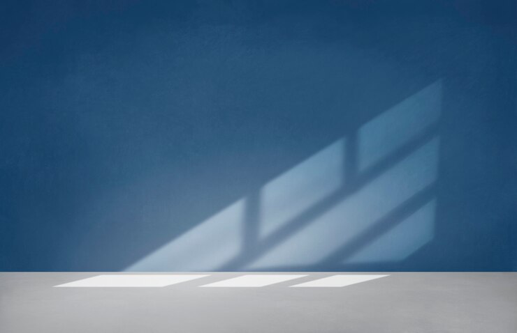 Free Photo blue wall in an empty room with concrete floor