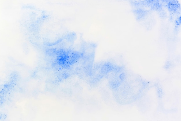 Blue watercolor spread on paper
