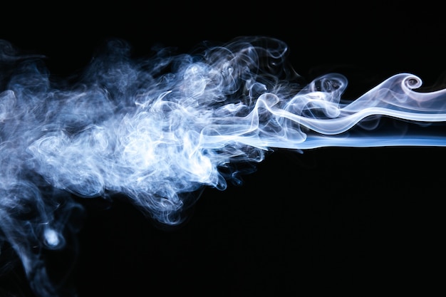 Blue wavy smoke on black background