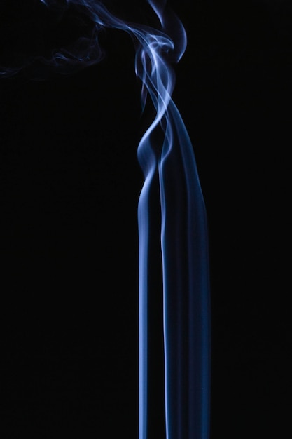 Blue wavy smoke on black background