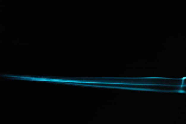 Blue wavy smoke on black background