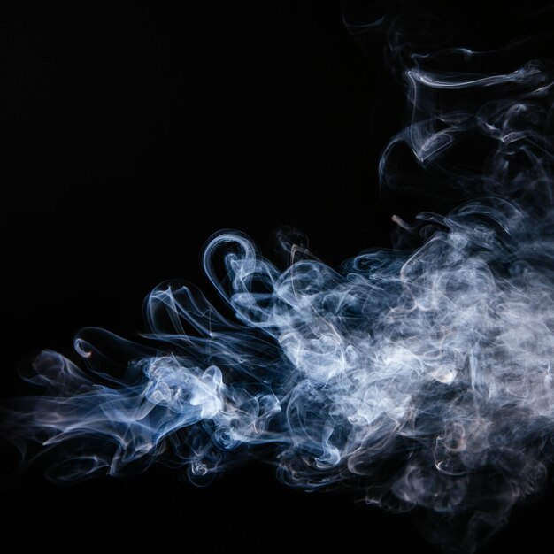 Blue wavy smoke on black background