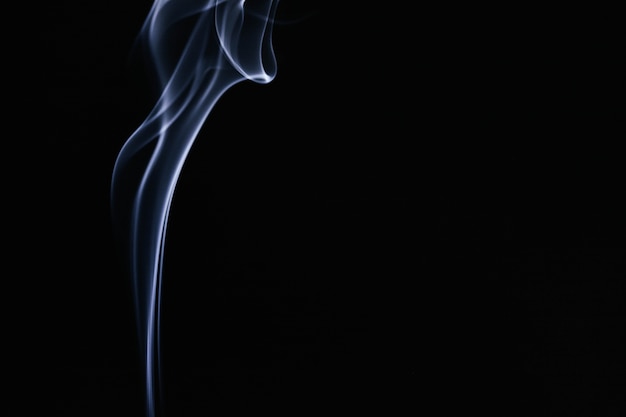 Blue wavy smoke on black background