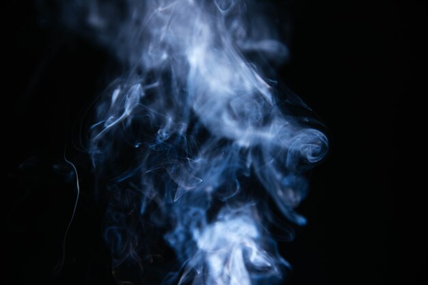 Blue wavy smoke on black background