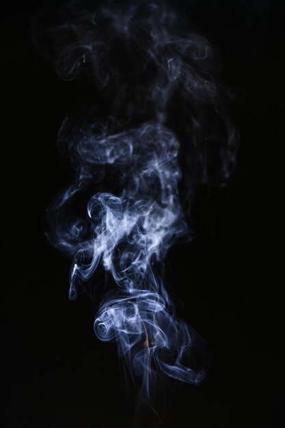 Blue wavy smoke on black background