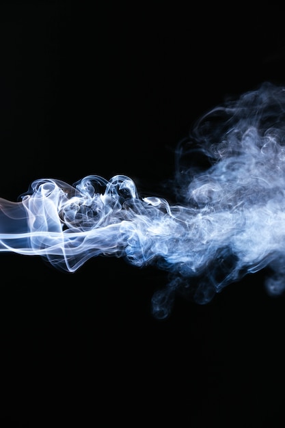 Blue wavy smoke on black background