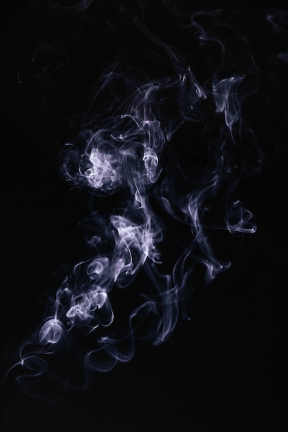 Blue wavy smoke on black background