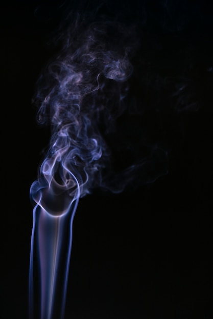 Blue wavy smoke on black background