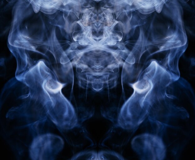 Blue wavy smoke on black background