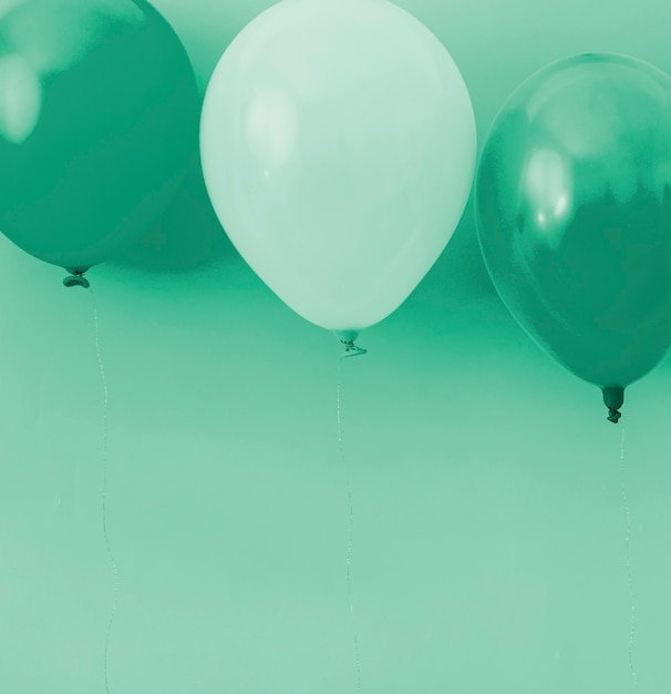 Blue and white balloons on blue background