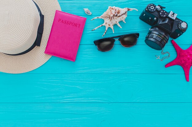 Blue wooden background with summer elements