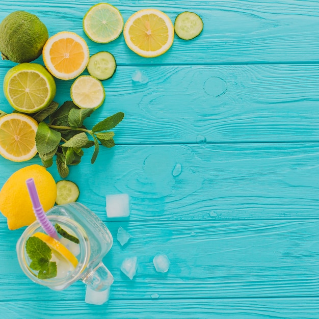 Blue wooden surface with lemons and limes