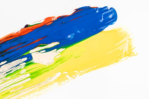 Free photo blue and yellow paint strokes on white background